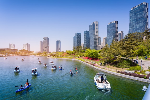 People are riding a tourist boat in summer of Korea at Central Park in Songdo District, Incheon South Korea.