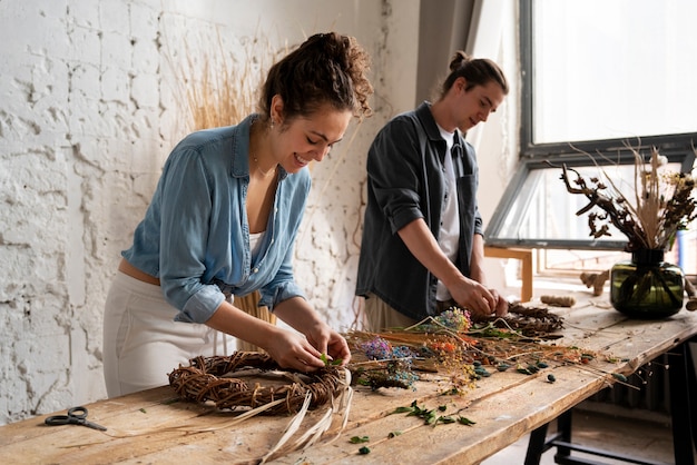 People building their own dried arrangement