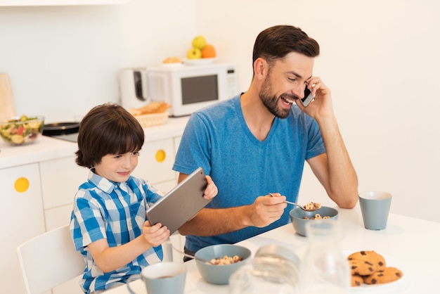 People communicate on the tablet with boy's mom