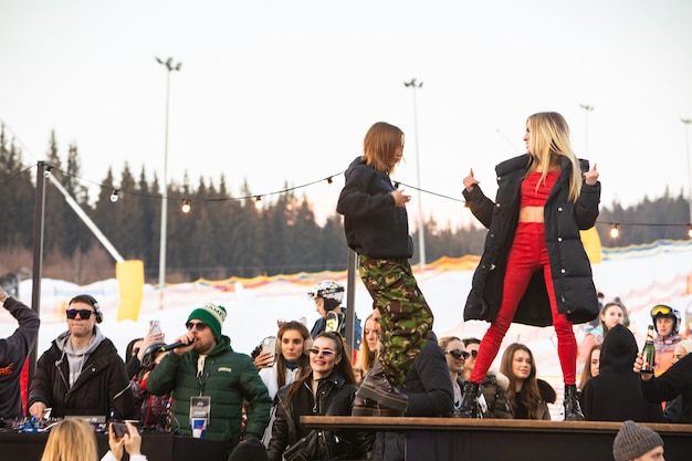 People dancing at the party after snowboarding day. ski resort. winter vacation. atlas weekend