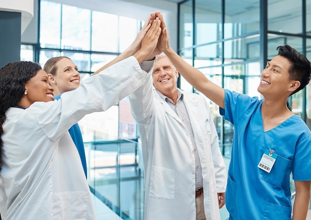 Photo people doctors and high five in celebration with success for surgery collaboration and healthcare goals in hospital medical team trust and hand connection for achievement solidarity and winning