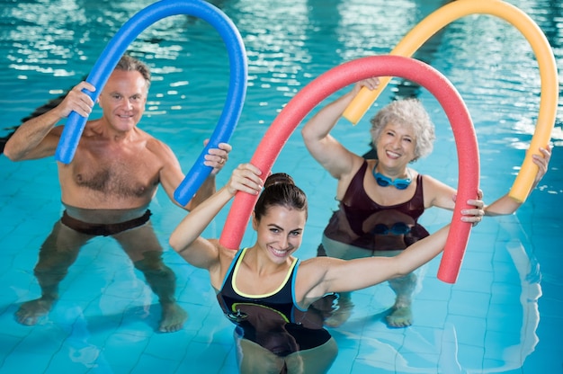 People doing exercise in a swimming pool