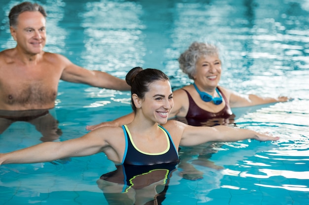 People doing exercise in a swimming pool