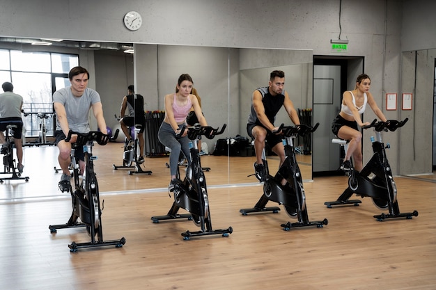 People doing indoor cycling