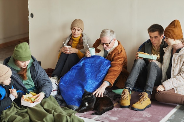 People Eating Food in Shelter