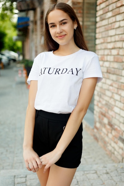 People, emotions, natural, beauty and lifestyle concept -Close-up Fashion woman portrait of young pretty trendy girl posing at the city, summer street fashion, laughing and smiling portrait. trendy