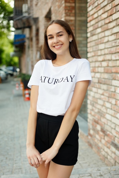 People, emotions, natural, beauty and lifestyle concept -Close-up Fashion woman portrait of young pretty trendy girl posing at the city, summer street fashion, laughing and smiling portrait. trendy