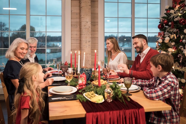 People enjoying a festive christmas dinner