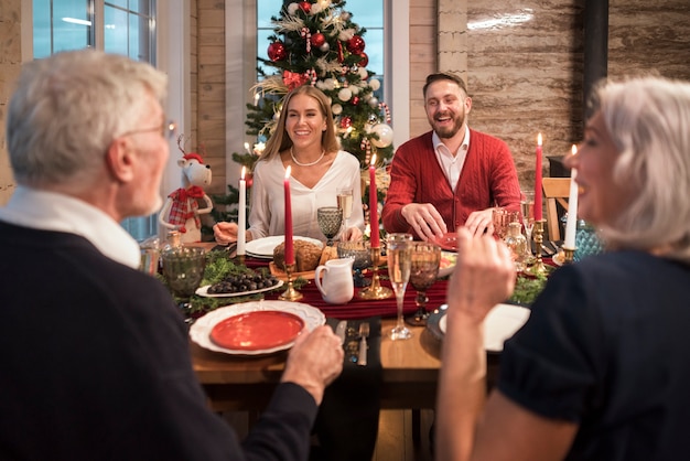 People enjoying a festive christmas dinner