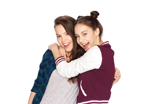 people, friends, teens and friendship concept - happy smiling pretty teenage girls hugging