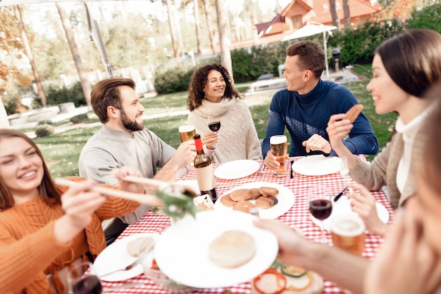 People gathered in nature on a sunny day.