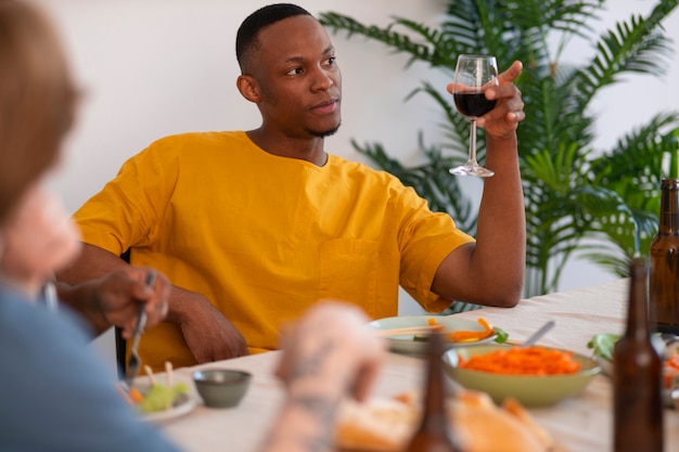 People having food and drinks at a dinner party