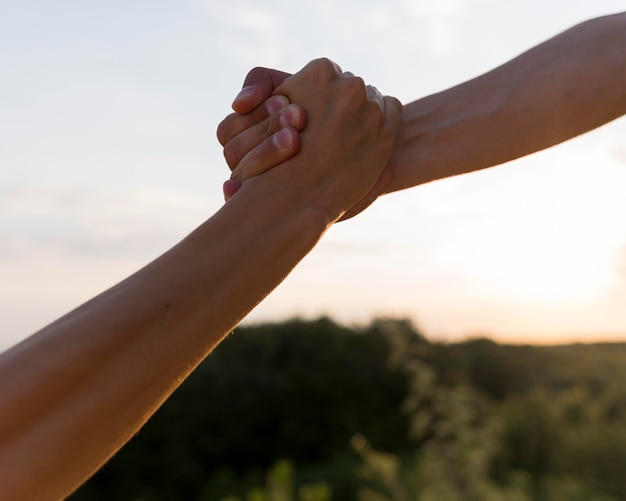 People holding each other by the hand