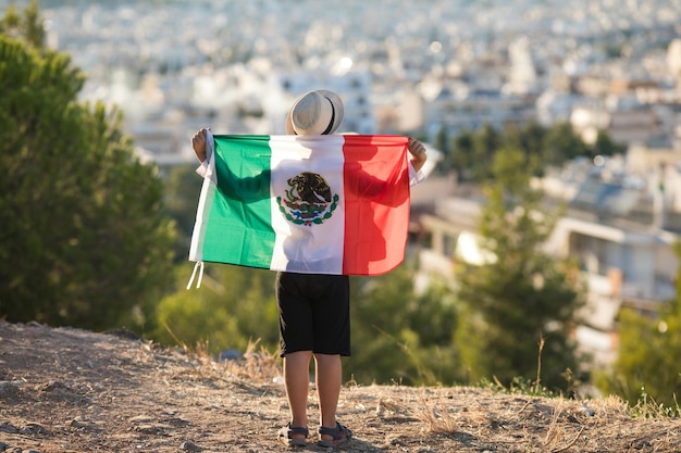 People holding flag of Mexico September 16 Independence Day of Mexico