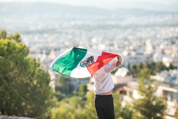 People holding flag of Mexico September 16 Independence Day of Mexico