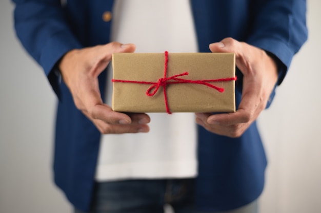 People holding gift box, new year gift box, Christmas gift box ,copy space. Christmas, hew year, birthday concept.