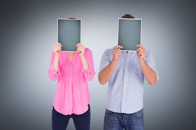 People holding sheets over faces against grey vignette