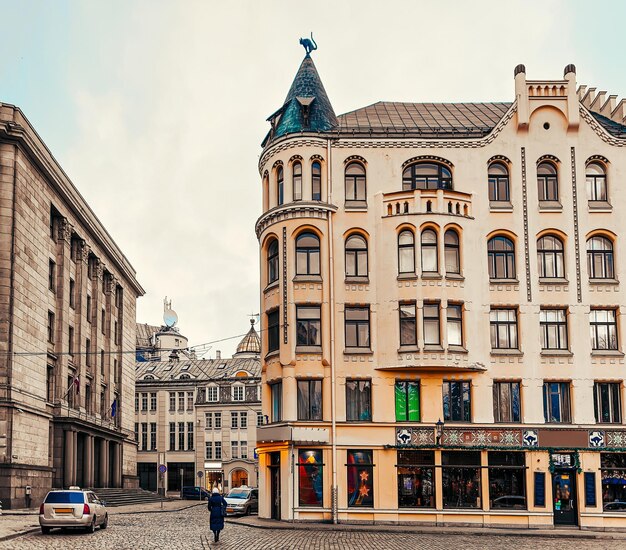 People at the House with Cats in the Old Town of Riga in Latvia in winter.