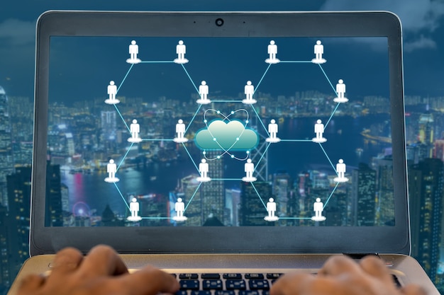 People icons link together with other and city night view in background that represent global networking for technology and business idea.