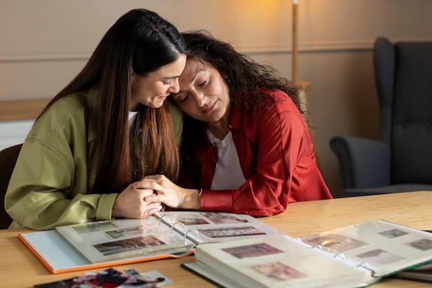 People looking over picture albums