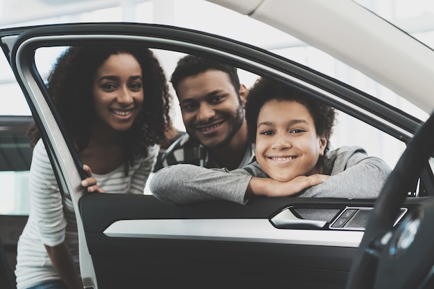 People Looking through Car Window Family Buy Car.