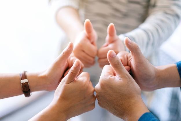 People making thumb up sign in circle