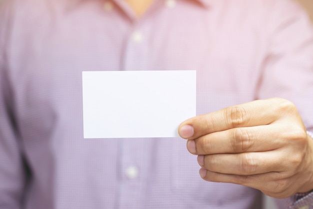 People man hand hold business cards show blank white card  or pasteboard credit name card display front. Business branding concept.