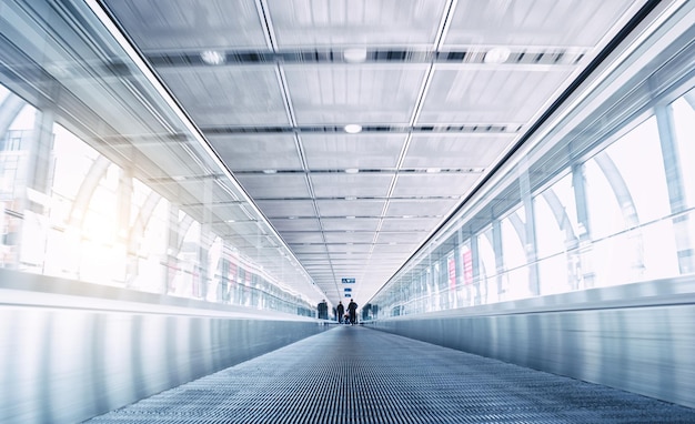 People on a modern Skywalk in a airport. ideal for websites and magazines layouts.