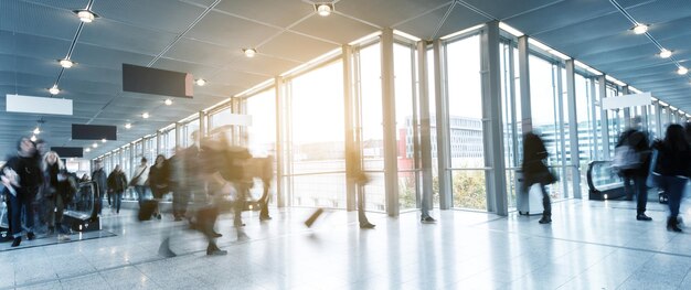 People in motion at a traidshow corridor