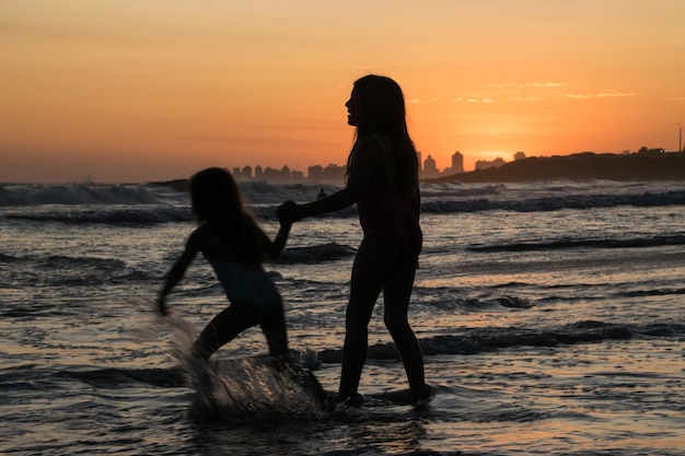 People playing in the beach during summer