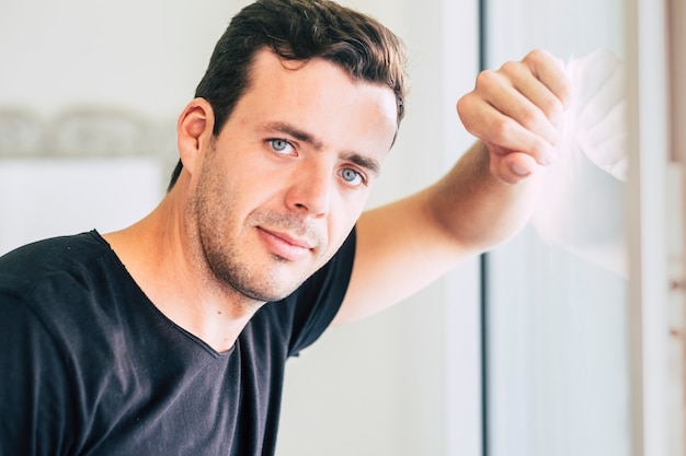 People portrait with handsome man standing and looking at the camera 