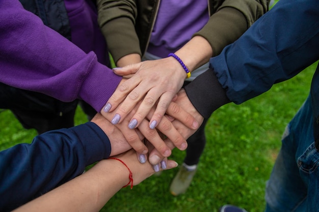 People put their hands together Selective focus