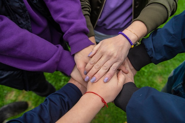 People put their hands together Selective focus