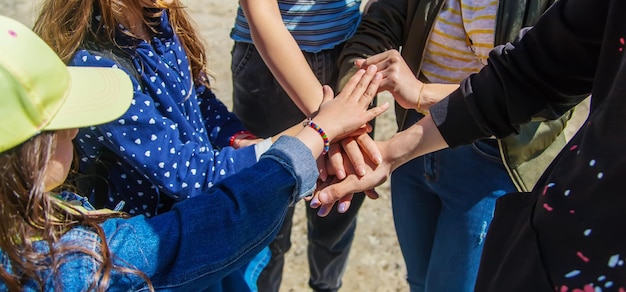 People put their hands together Selective focus