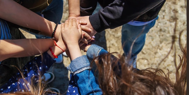 People put their hands together Selective focus