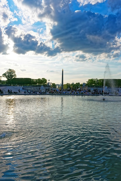 People relaxing at Tuileries Gardens in Paris in France