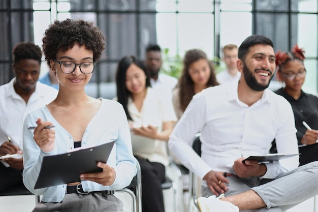 People sitting in business seminar room in hotel business