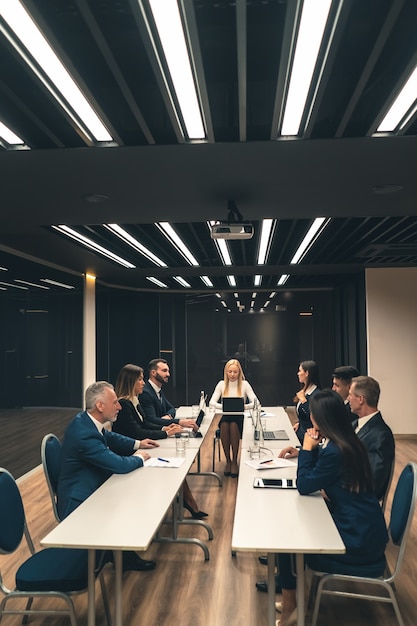 The people sitting at the table on the business meeting