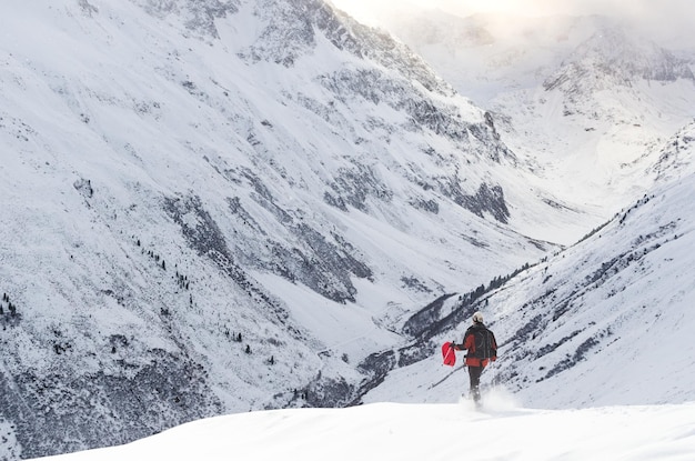 People skiing on snow covered landscape