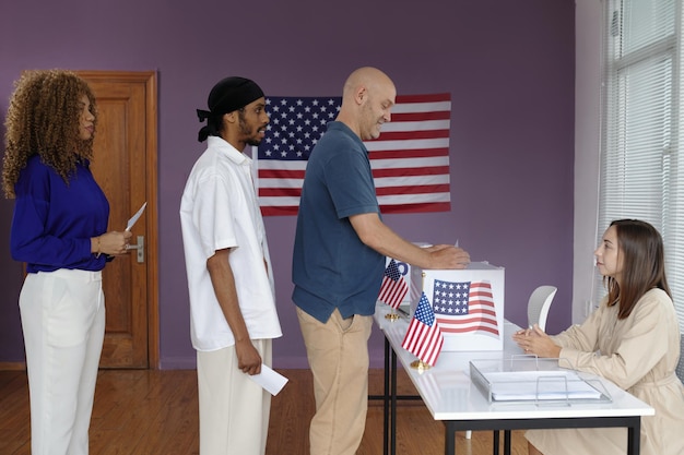 People standing in queue to vote for their president