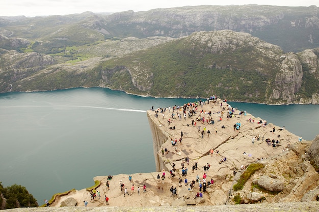 People on top of the Preikestolen cliff in Norway