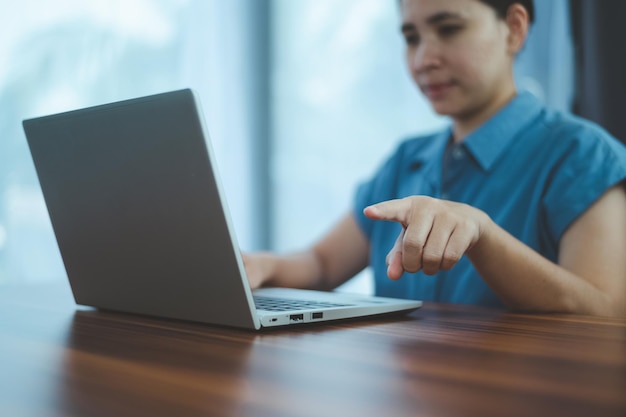 People using computer Side view of male hands typing on laptop keyboard