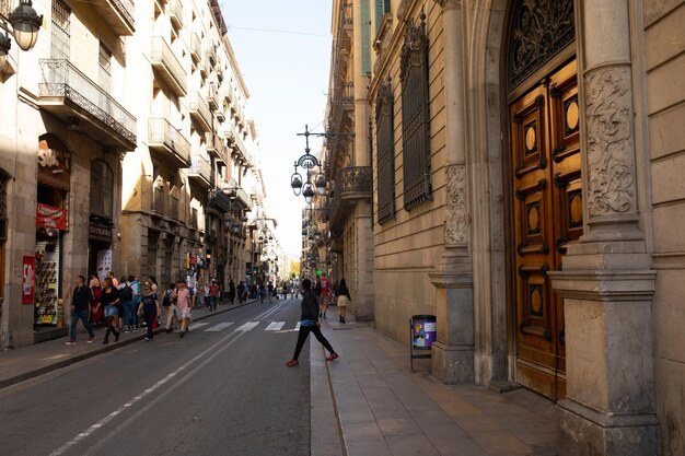 People Visiting The Gothic Quarter Which Is The Historic Centre Of The Old City Of Barcelona.