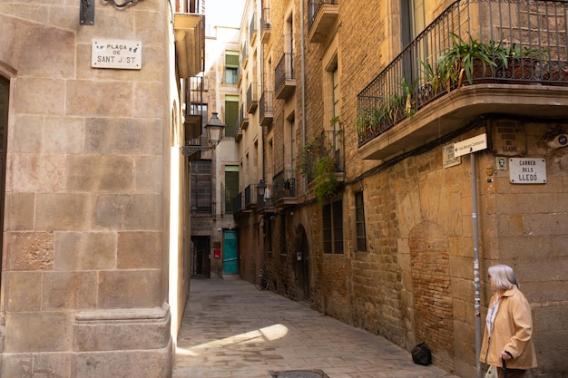 People Visiting The Gothic Quarter Which Is The Historic Centre Of The Old City Of Barcelona.