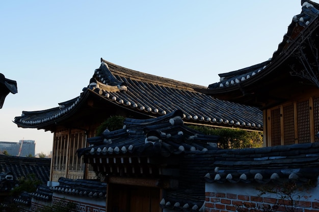 People walk on the street on MARCH 222019 in SeoulKorea Bukchon Hanok Village is a Korean traditional village in Seoul with a long history located on the top of a hill