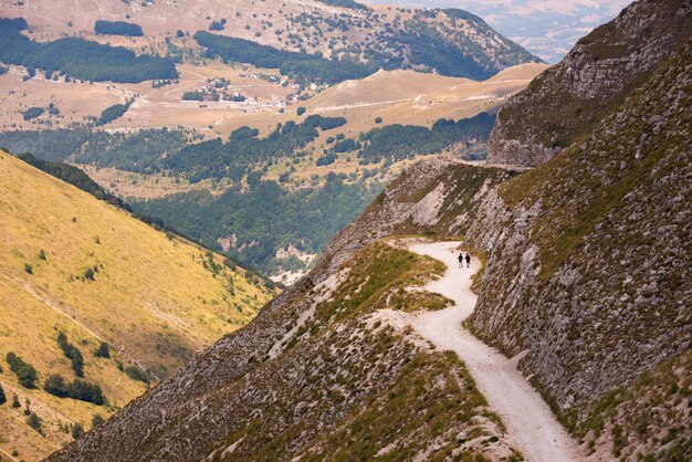 People walking on mountain road beautiful nature of Italy