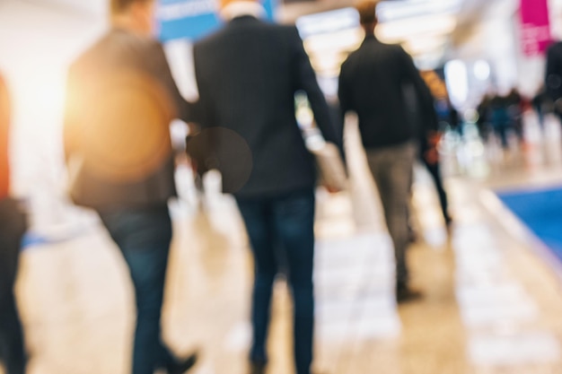 people walking in trade fair Intentionally blurred background