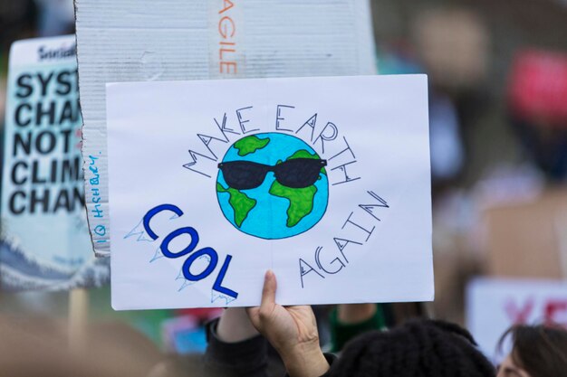 Photo people with banners protest as part of a climate change march