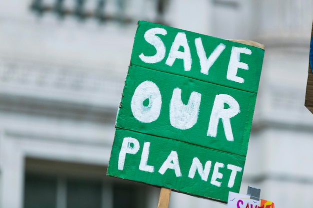 People with banners protest as part of a climate change march