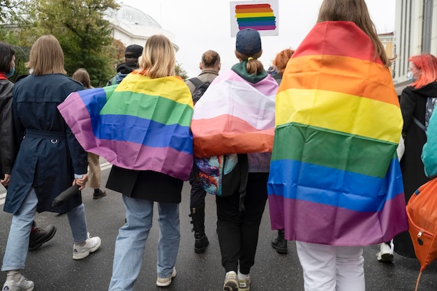 Photo people with lgbt flags are marching